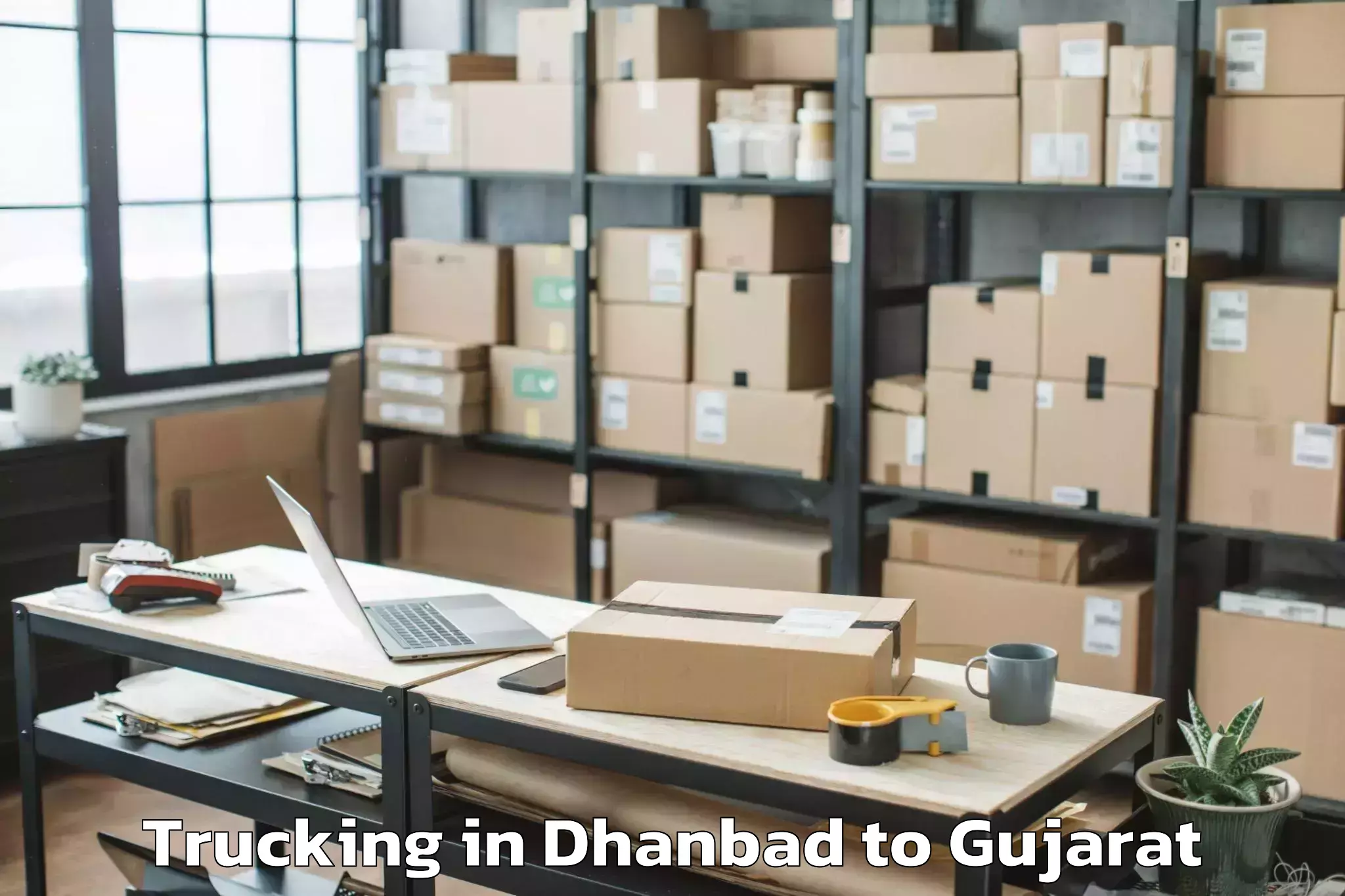 Book Dhanbad to Rajpipla Trucking Online